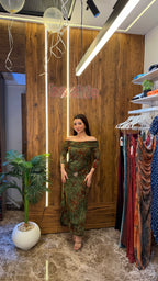 “Olive green tulle dress with orange floral print”