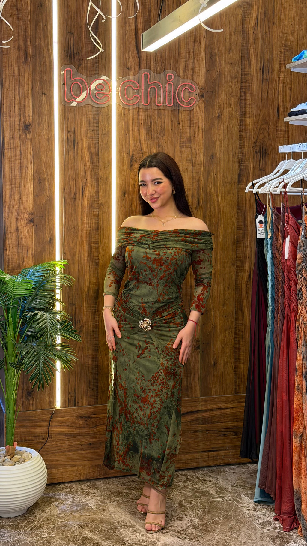 “Olive green tulle dress with orange floral print”