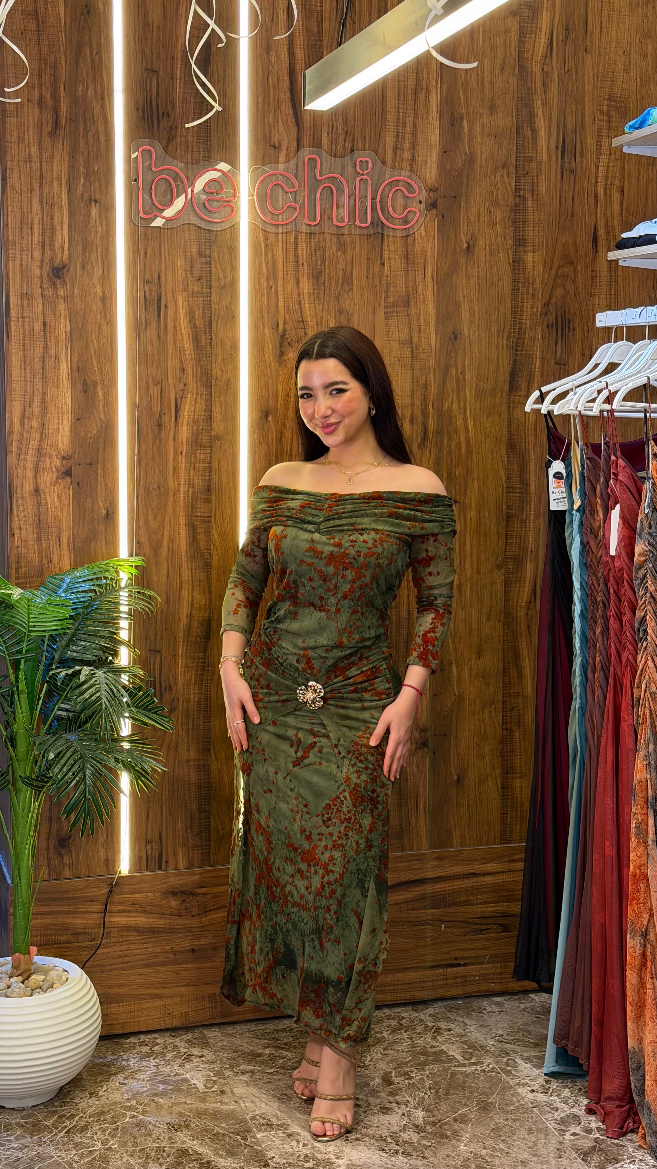 “Olive green tulle dress with orange floral print”