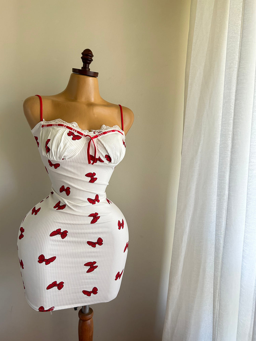 The dress is a ribbed, cotton bolero.