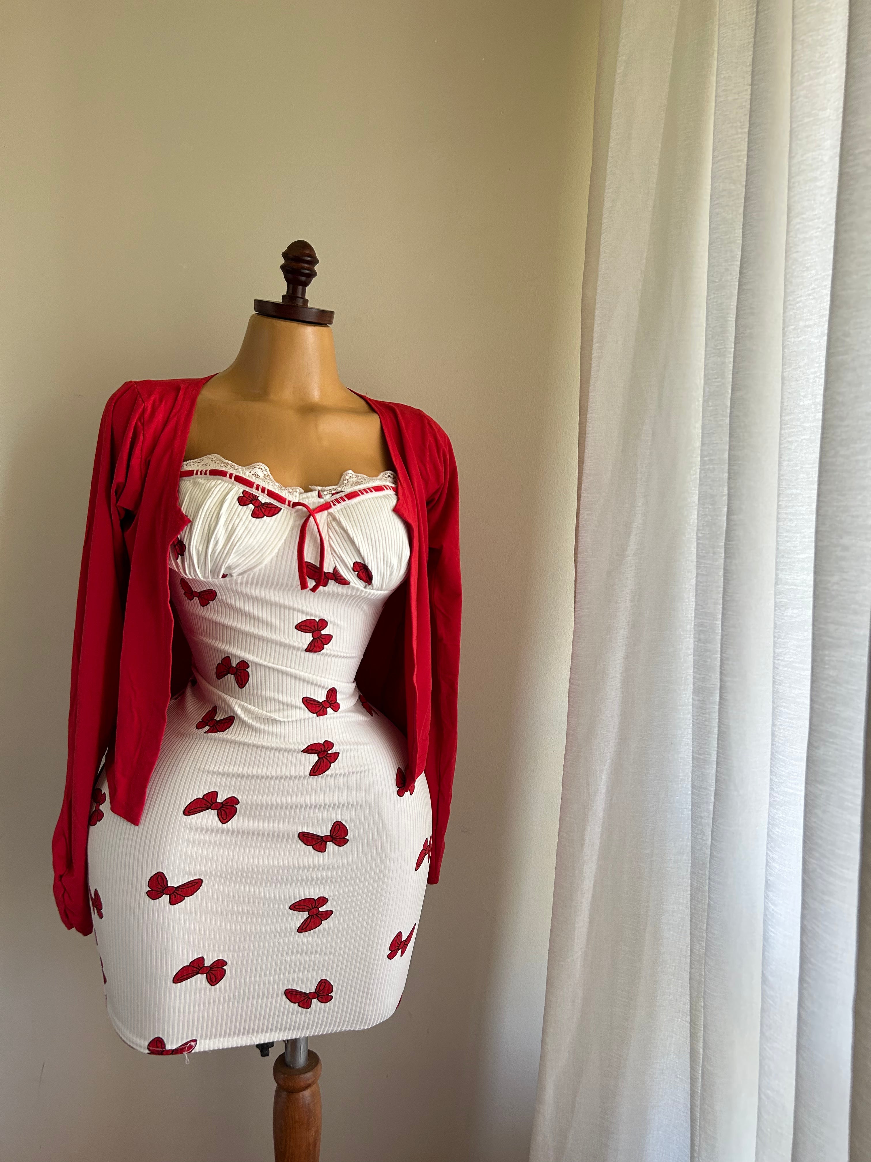 The dress is a ribbed, cotton bolero.
