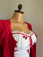 The dress is a ribbed, cotton bolero.