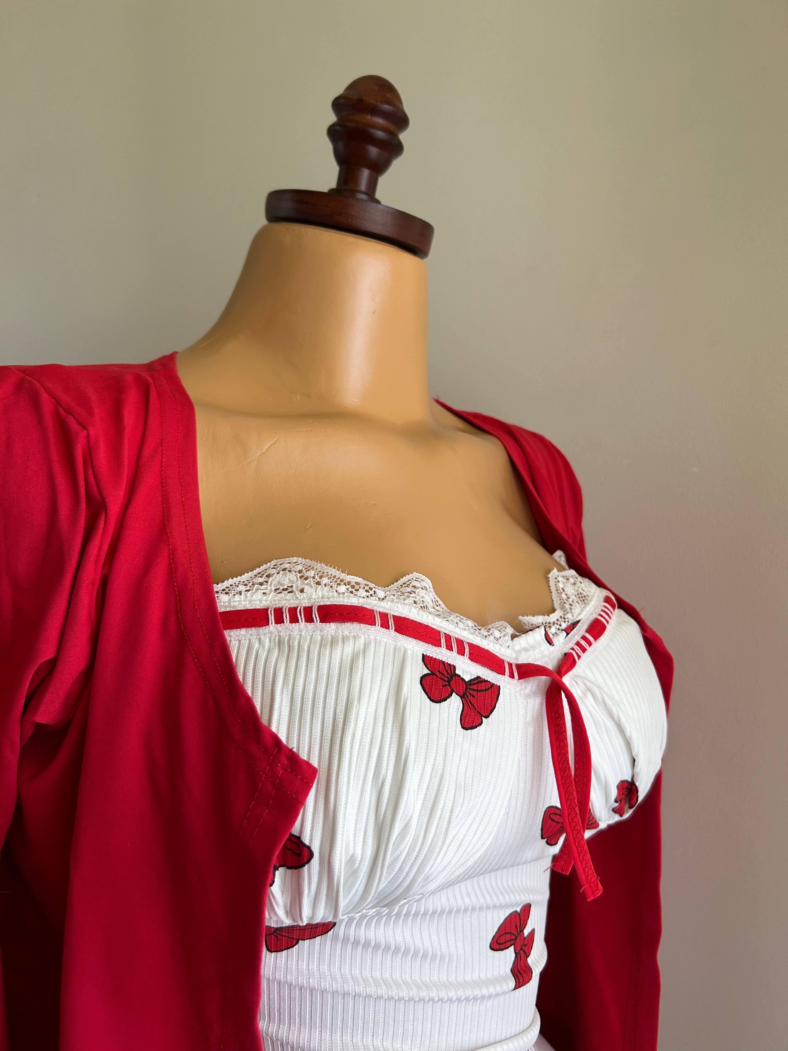 The dress is a ribbed, cotton bolero.